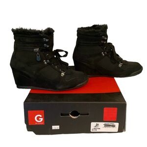Black Guess Royce wedge heel booties.